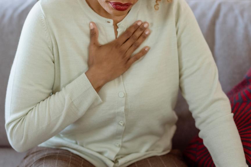 Woman clutching her chest