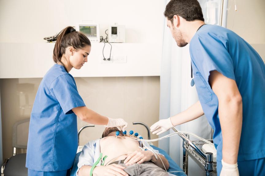Health care professionals checking on a patient in a hospital