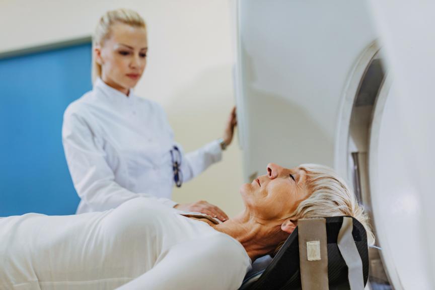 Female physician with patient at MRI