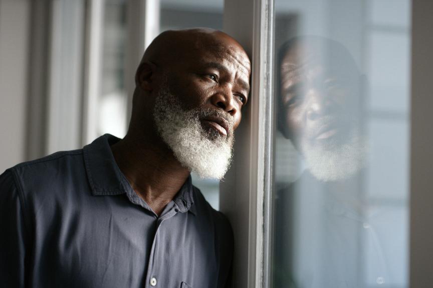 Man looking out of a window