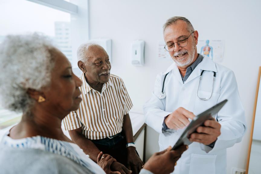 Elderly couple with a physician