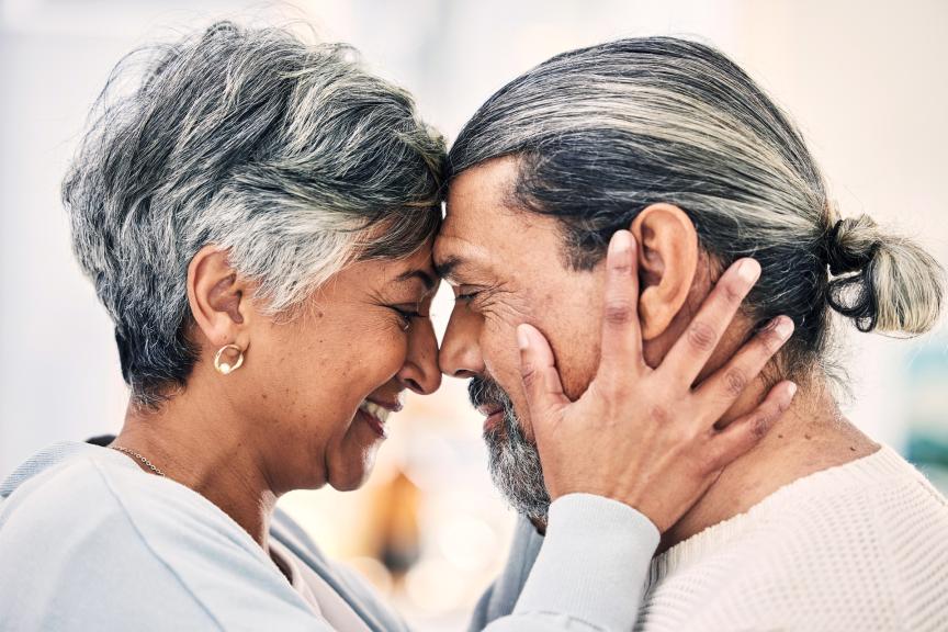 Older couple touching forheads 