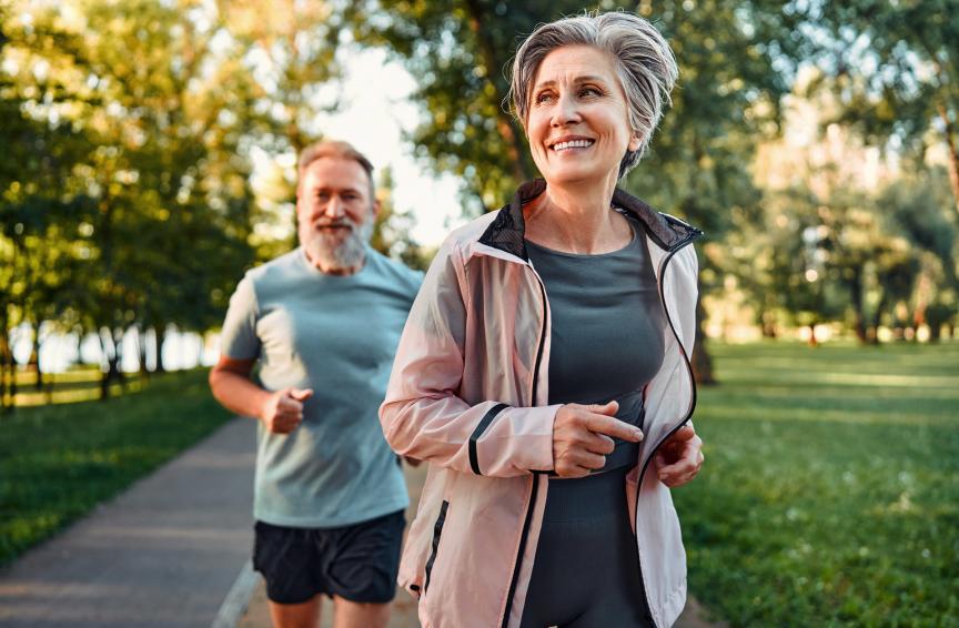 Older couple running in the park