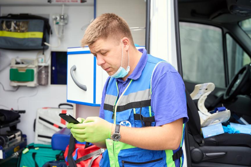 EMT in front of an ambualnce