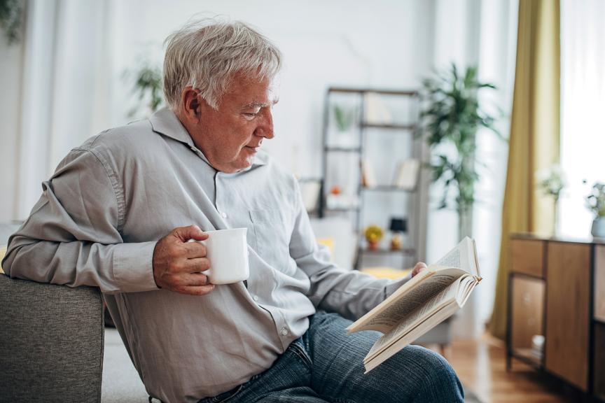 Elderly man drinking a cup of tea