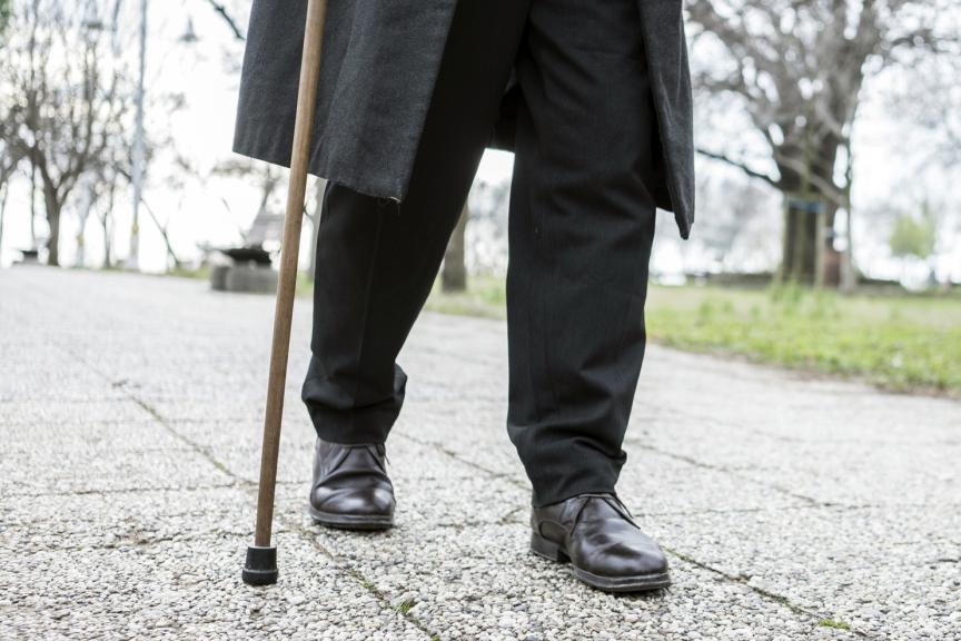 Patients Peripheral Arterial Disease Man walking on a stick