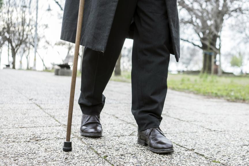 Man walking on a stick