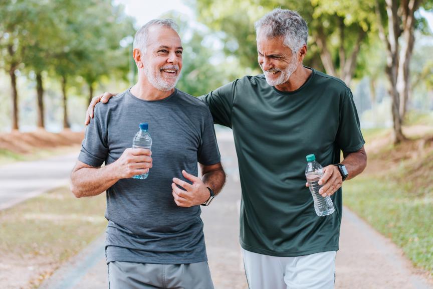 Two men walking in a park