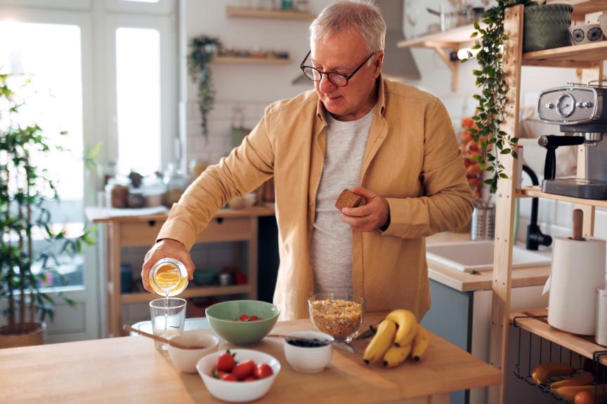 Older man preparing a healthy breakfast